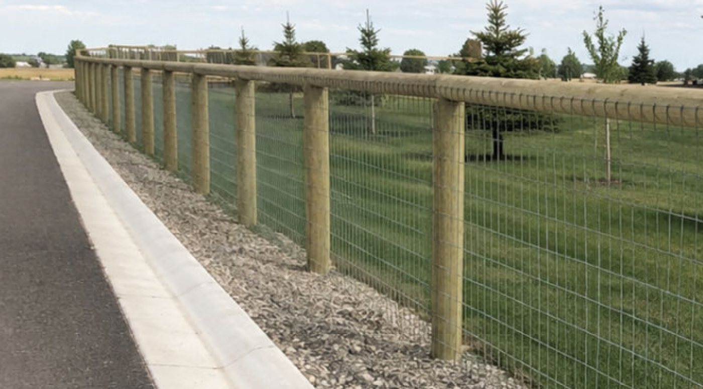 Round wood post and rail agriculture fence with 2x4 welded wire